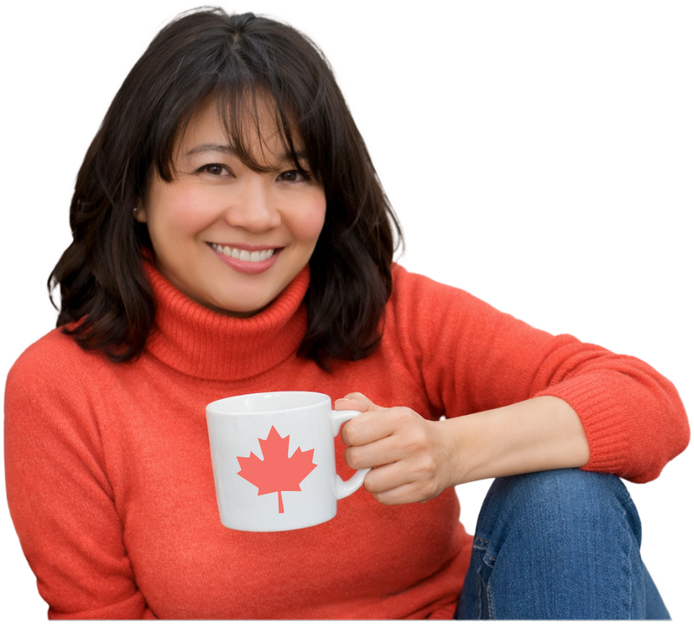 Charlene holding a mug with a maple leaf